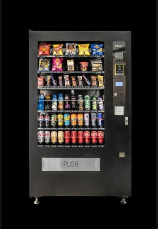 A stocked vending machine already installed at a workplace